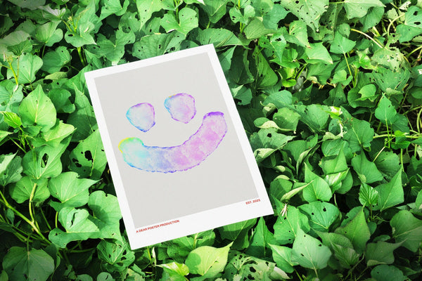 High Happy Face minimalist Danish art poster with soft blue og purple colors, making a happy face on enhanced matte paper. Poster placed in nature.